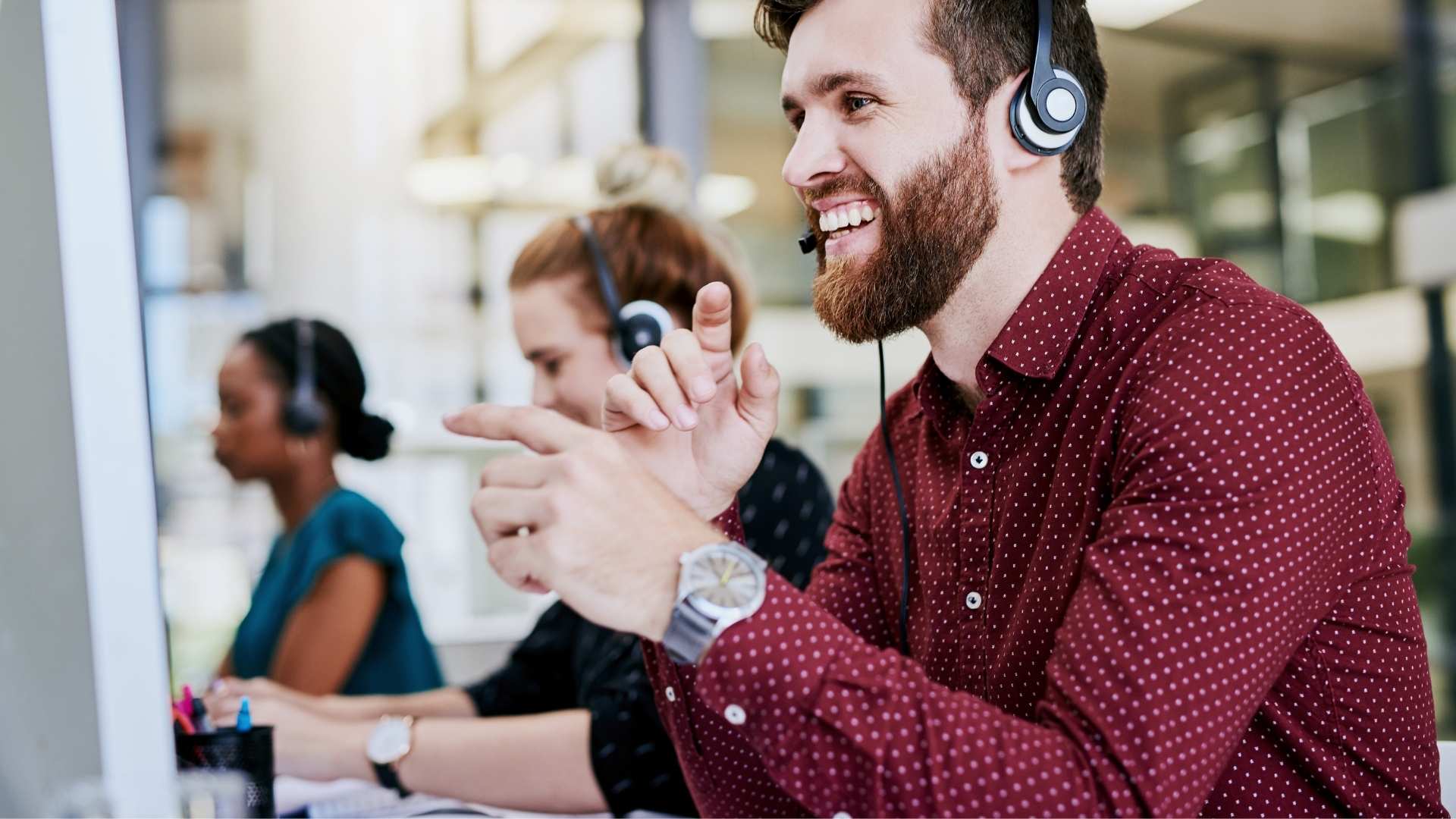 Sales person offers great customer service wearing a headset